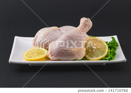 fresh raw chicken drumsticks with skin intact for cooking fresh raw chicken drumsticks with skin intact for cooking 141710768