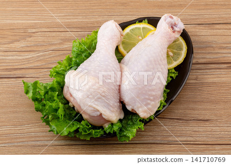 fresh raw chicken drumsticks with skin intact for cooking fresh raw chicken drumsticks with skin intact for cooking 141710769