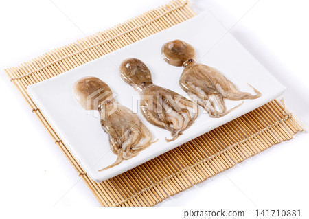 cleaned raw baby octopus prepared for grilling and seafood stew 141710881