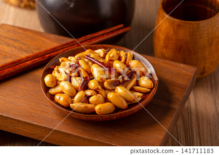 spicy roasted peanuts with chili peppers packed in sealed container spicy roasted peanuts with chili peppers packed in sealed container 141711183