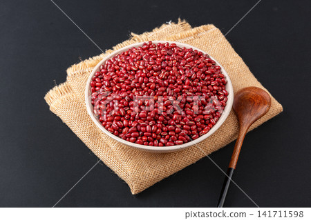 raw organic red adzuki beans filled in ceramic bowls raw organic red adzuki beans filled in ceramic bowls 141711598