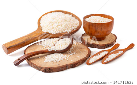raw white glutinous sticky rice with wrapped bamboo rice dumplings raw white glutinous sticky rice with wrapped bamboo rice dumplings 141711622