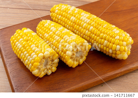 boiled fruit sweet corn cobs and cut segments isolated on white background boiled fruit sweet corn cobs and cut segments isolated on white background 141711667