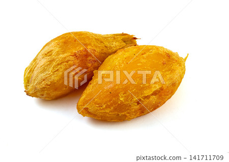 roasted yellow sweet potato pieces served in dark bowl roasted yellow sweet potato pieces served in dark bowl 141711709