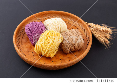 assorted Colored Dried Cantonese Jook Sing Noodle Cakes assorted Colored Dried Cantonese Jook Sing Noodle Cakes 141711740