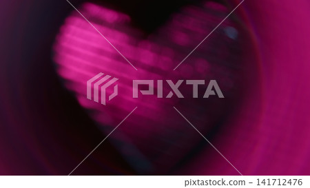 Blur glow romantic. Shine love. Defocused neon magenta pink purple color sparkle heart lens flare glare flicker gleam on abstract dark black art background. Blur glow romantic. Shine love. Defocused neon magenta pink purple color sparkle heart lens flare glare flicker gleam on abstract dark black art background. 141712476