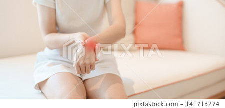 Woman having wrist pain for Carpal Tunnel Syndrome, Wrist Tendinitis, muscle ache, De Quervain s tenosynovitis, ergonomic, Hand Osteoarthritis, Office syndrome and Parkinson disease concept Woman having wrist pain for Carpal Tunnel Syndrome, Wrist Tendinitis, muscle ache, De Quervain s tenosynovitis, ergonomic, Hand Osteoarthritis, Office syndrome and Parkinson disease concept 141713274