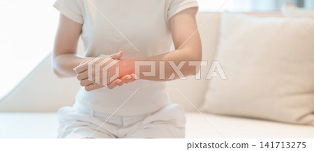 Woman having wrist pain for Carpal Tunnel Syndrome, Wrist Tendinitis, muscle ache, De Quervain s tenosynovitis, ergonomic, Hand Osteoarthritis, Office syndrome and Parkinson disease concept Woman having wrist pain for Carpal Tunnel Syndrome, Wrist Tendinitis, muscle ache, De Quervain s tenosynovitis, ergonomic, Hand Osteoarthritis, Office syndrome and Parkinson disease concept 141713275
