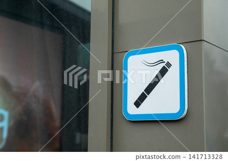 Sign indicates no smoking policy in public space Sign indicates no smoking policy in public space 141713328