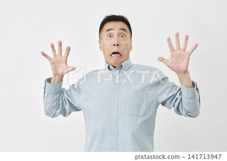 Surprised man on white background Surprised man on white background 141713947