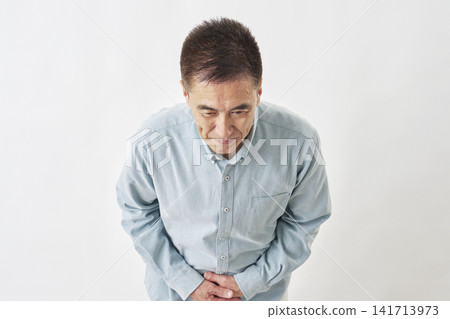A man bowing on a white background A man bowing on a white background 141713973