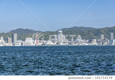 Kobe City, Hyogo Prefecture: A view of the city of Kobe on a clear day, seen from across the bay. 141714179