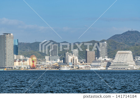 Kobe City, Hyogo Prefecture: A view of the city of Kobe on a clear day, seen from across the bay. Kobe City, Hyogo Prefecture: A view of the city of Kobe on a clear day, seen from across the bay. 141714184