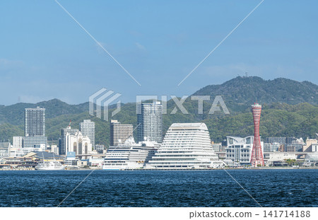 Kobe City, Hyogo Prefecture: A view of the city of Kobe on a clear day, seen from across the bay. Kobe City, Hyogo Prefecture: A view of the city of Kobe on a clear day, seen from across the bay. 141714188