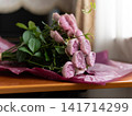 A bouquet of pink roses on the table A bouquet of pink roses on the table 141714299