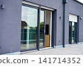 Open sliding glass door to outdoor terrace 141714352