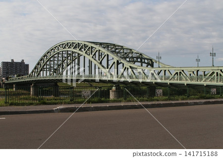 Asahi Bridge over the Ishikari River, a landmark of Asahikawa City, Hokkaido. Asahi Bridge over the Ishikari River, a landmark of Asahikawa City, Hokkaido. 141715188