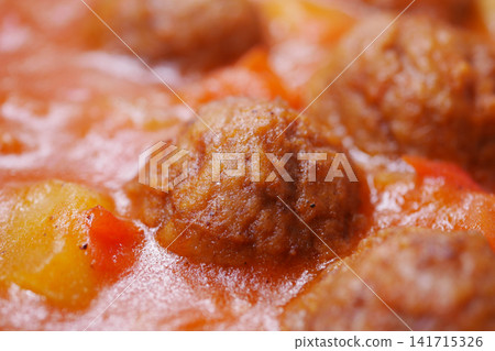 Meatballs cooking in tomato sauce in a kitchen Meatballs cooking in tomato sauce in a kitchen 141715326