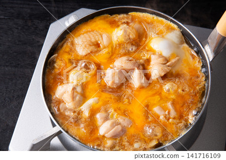 Oyakodon being cooked in a pot Oyakodon being cooked in a pot 141716109