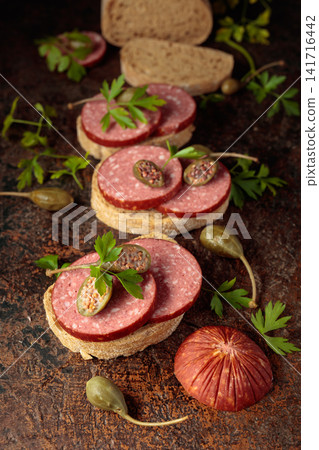 Sandwiches with smoked sausage on a vintage background. 141716442