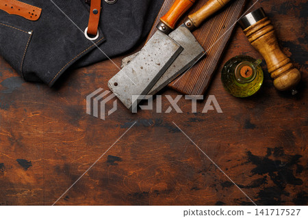 Meat cooking utensils on wooden table Meat cooking utensils on wooden table 141717527