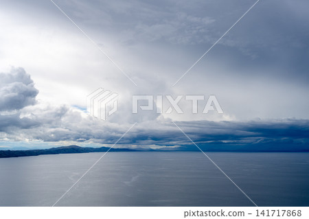 View of Lake Titicaca from Amantani Island under stormy clouds View of Lake Titicaca from Amantani Island under stormy clouds 141717868