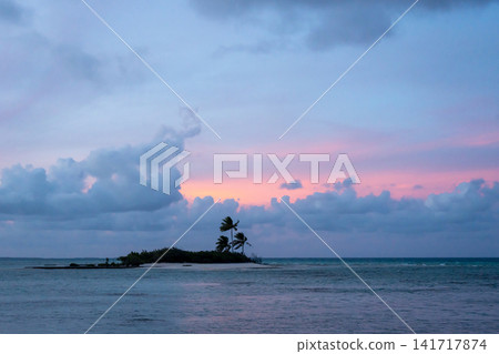 Sunset over a tropical motu on Tikehau Atoll, French Polynesia Sunset over a tropical motu on Tikehau Atoll, French Polynesia 141717874