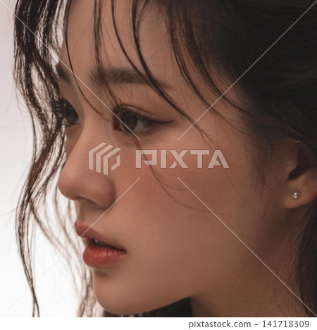 Beautiful Young Asian Woman with Natural Glowing Skin, Smooth Black Hair and Healthy Fresh Beauty Portrait Beautiful Young Asian Woman with Natural Glowing Skin, Smooth Black Hair and Healthy Fresh Beauty Portrait 141718309