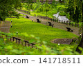 A walking path and river scenery in the lush green Onogawa Onsen town. 141718511