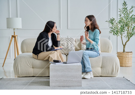 Psychologist consulting young female patient in office Psychologist consulting young female patient in office 141718733