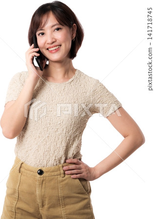 Asian woman portrait phone smile beige shirt showing cheerful confidence against isolated background for lifestyle concept Asian woman portrait phone smile beige shirt showing cheerful confidence against isolated background for lifestyle concept 141718745