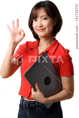 Asian woman red shirt tablet gesture showing confidence with isolated studio portrait and friendly smile Asian woman red shirt tablet gesture showing confidence with isolated studio portrait and friendly smile 141718755