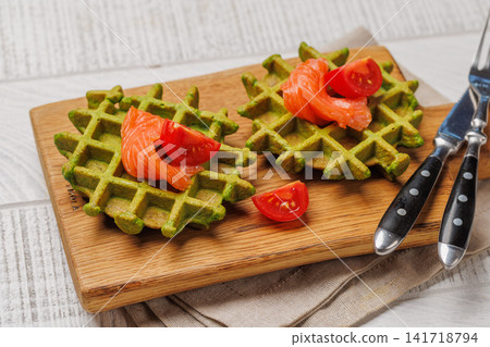 Vegan spinach waffles top view Vegan spinach waffles top view 141718794