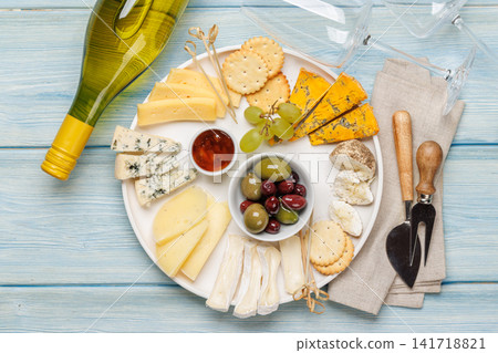 Cheese board with olives grapes and honey Cheese board with olives grapes and honey 141718821