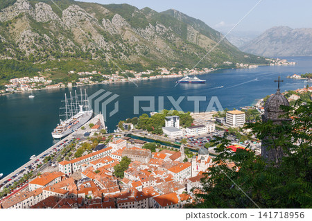 Scenic coastal town with mountains and bay view Scenic coastal town with mountains and bay view 141718956
