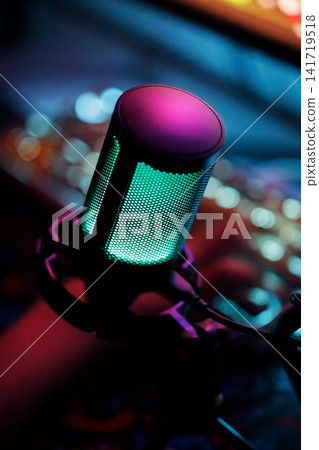 Streamer microphone macro detail with dark background and bokeh LEDs Streamer microphone macro detail with dark background and bokeh LEDs 141719518