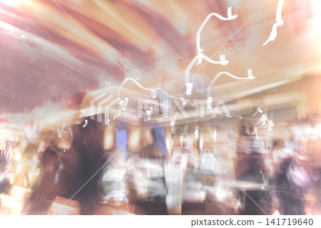 A dreamy indoor motion-blur abstract background where soft pink light and human silhouettes blend together. 141719640