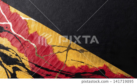 A black background with vermilion and gold torn Japanese paper, leaving a margin in the upper right corner. 141719895