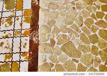 Geometric texture background of a floor surface with different types of stone laid out. Geometric texture background of a floor surface with different types of stone laid out. 141720084