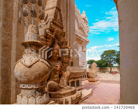 Ananda Temple in Bagan Myanmar with golden spires and traditional Mon style Buddhist architecture on the temple plain Ananda Temple in Bagan Myanmar with golden spires and traditional Mon style Buddhist architecture on the temple plain 141720468