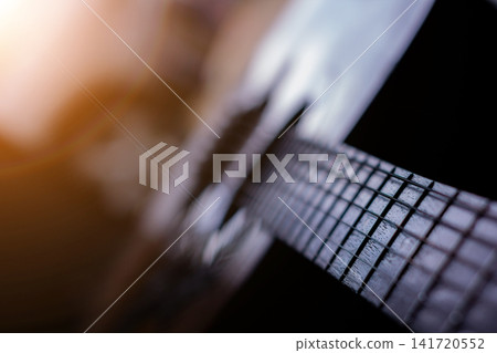 Guitar melody with expressive chords and solo performance creating emotional musical atmosphere. Guitar melody with expressive chords and solo performance creating emotional musical atmosphere. 141720552