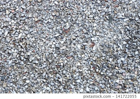 Top view texture of small crushed gray gravel stones. Ideal as natural rock background for construction, landscaping, road materials, architectural visualization, game assets, and graphic design 141722055