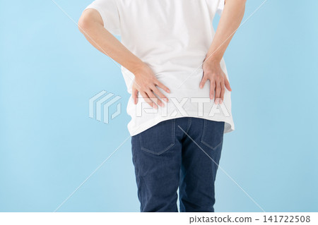 Lower back pain, male, hands Lower back pain, male, hands 141722508