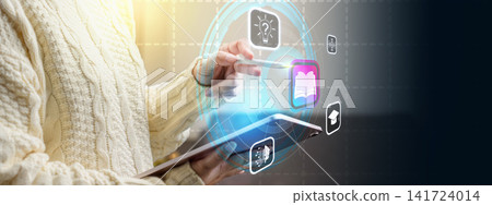 A female using a digital tablet to interact with futuristic educational icons and learning tools, symbolizing e-learning and digital transformation. E-learning technology and online education concept A female using a digital tablet to interact with futuristic educational icons and learning tools, symbolizing e-learning and digital transformation. E-learning technology and online education concept 141724014