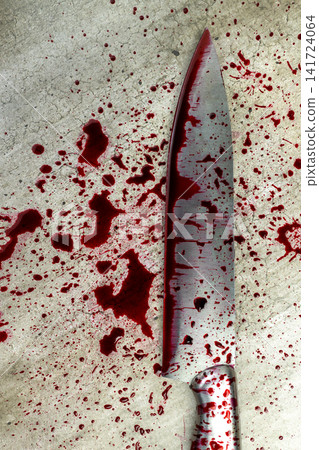 A sharp kitchen knife covered in fresh red blood splatters lying on a grey concrete background, suggesting a violent crime scene, murder, or horror concept. Concept of Halloween A sharp kitchen knife covered in fresh red blood splatters lying on a grey concrete background, suggesting a violent crime scene, murder, or horror concept. Concept of Halloween 141724064