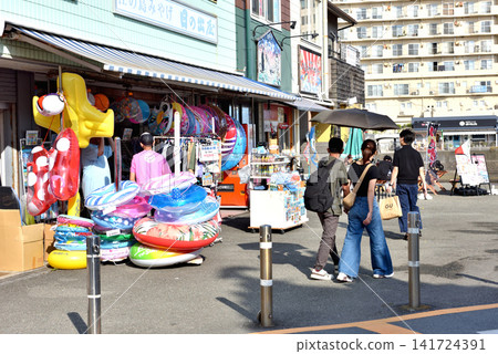 The shops in front of Katase-Enoshima Station are filled with beach goods. The shops in front of Katase-Enoshima Station are filled with beach goods. 141724391