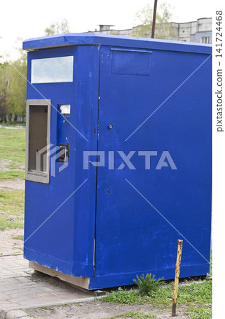 Drinking water dispenser installed in outdoor location for clean water access. Drinking water dispenser installed in outdoor location for clean water access. 141724468