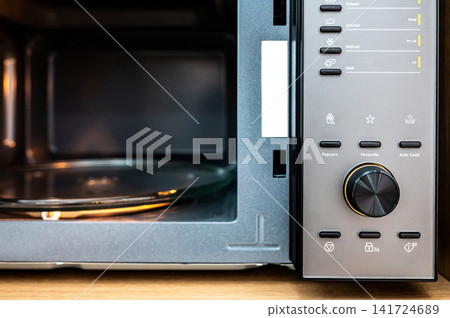 Empty microwave oven with open door Empty microwave oven with open door 141724689