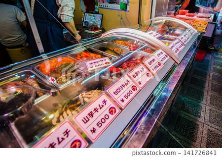 Various kimchi displayed in the showcase of a deli inside the shopping arcade in Osaka's Koreatown. Various kimchi displayed in the showcase of a deli inside the shopping arcade in Osaka's Koreatown. 141726841