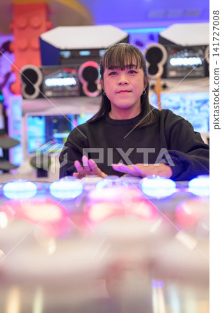 Vertical Close-Up of Asian Transgender Woman at Rhythm Arcade Game Vertical Close-Up of Asian Transgender Woman at Rhythm Arcade Game 141727008